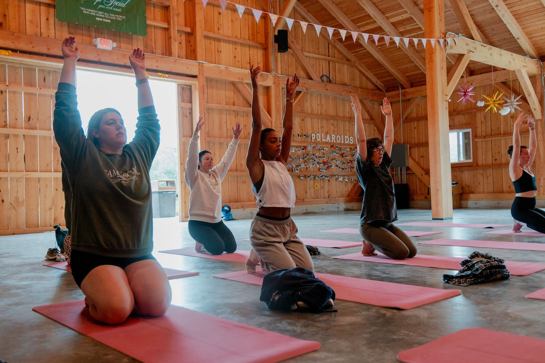 Women enjoying a wellness yoga session at Camp Social
