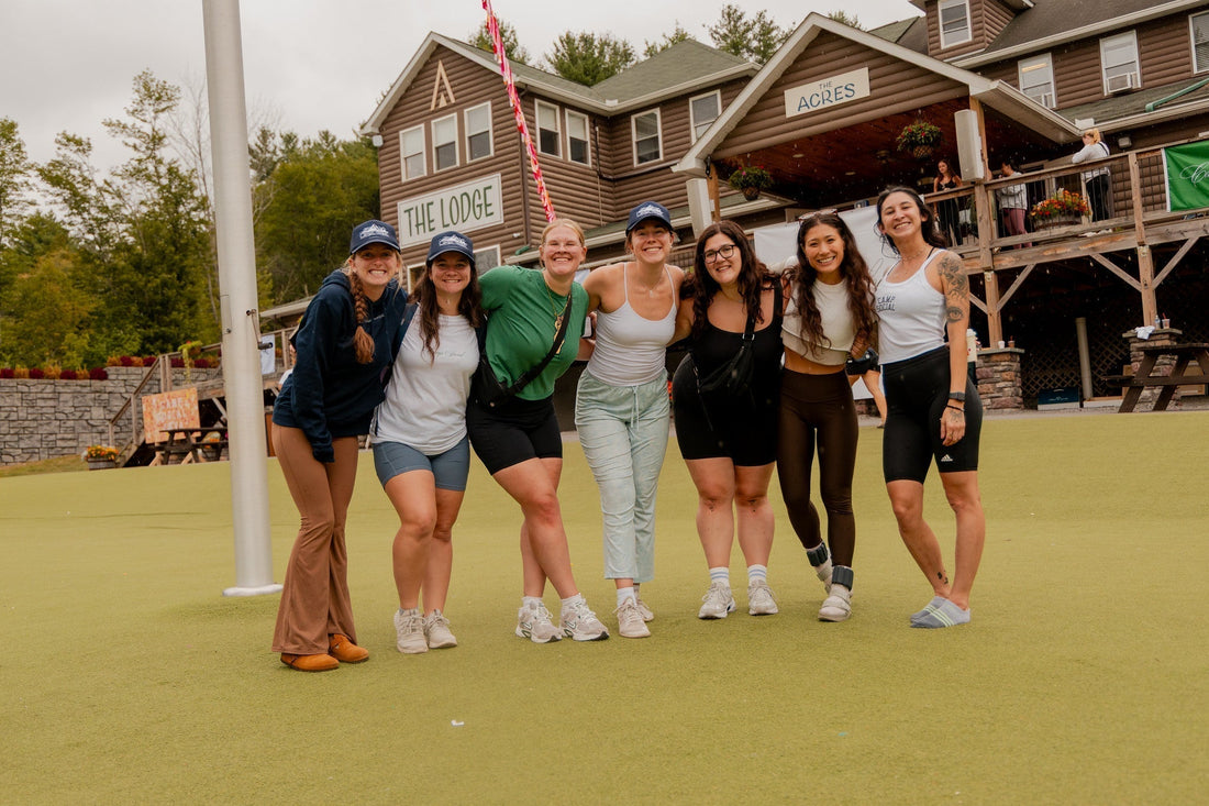 women smiling together outdoors at a lodge