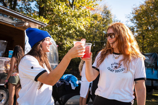 Friends enjoying social hobbies at camp by Camp Social