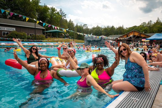Women having fun in a pool by Camp Social