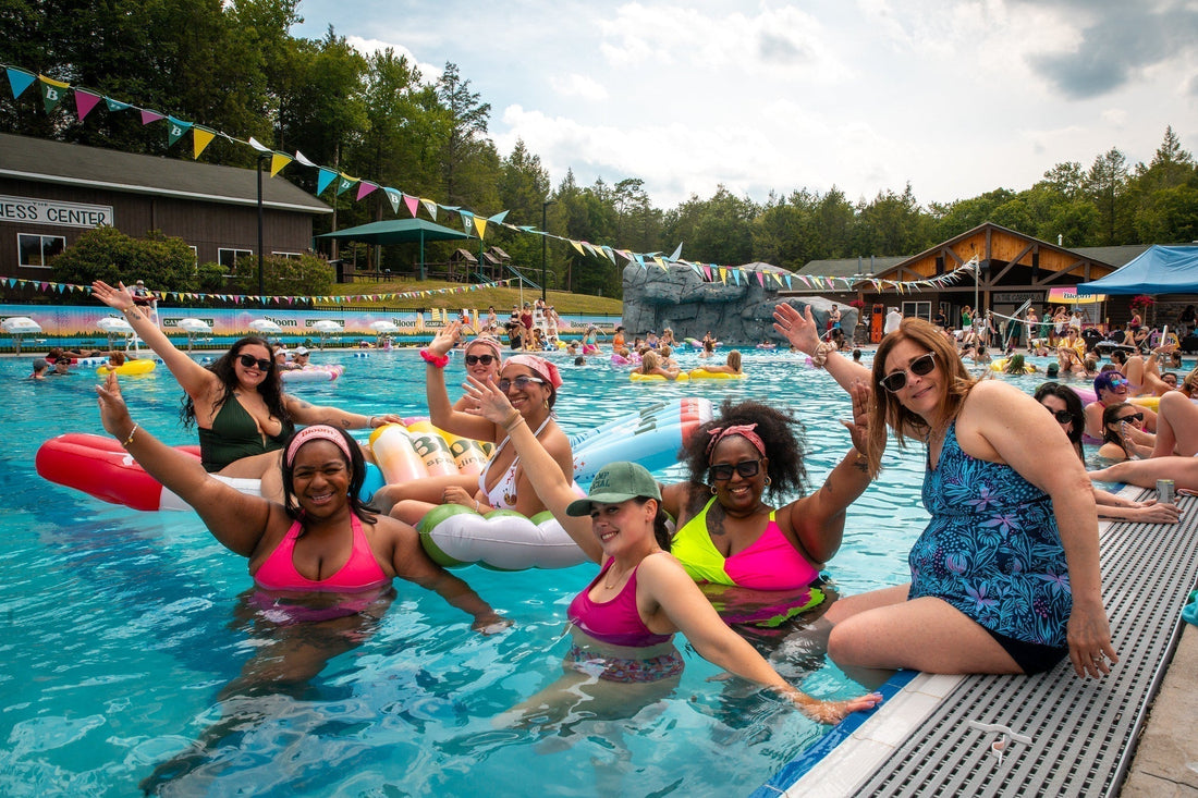 Women having fun in a pool by Camp Social