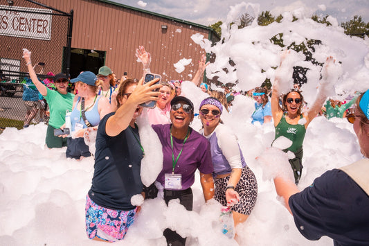 dults having fun at a summer camp event by Camp Social