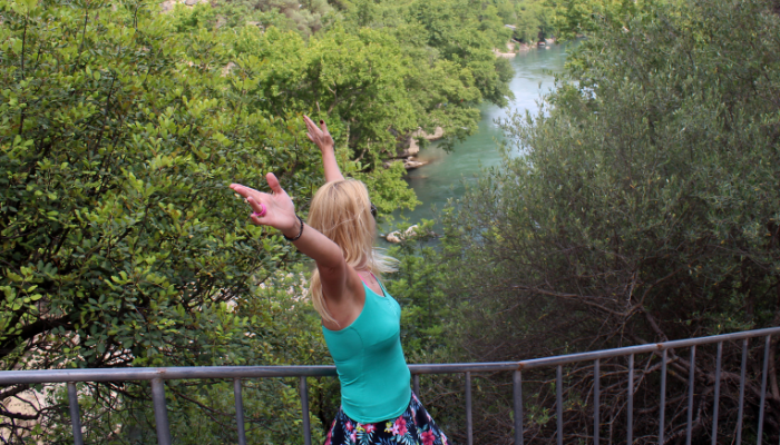 Solo traveler enjoying a scenic river view