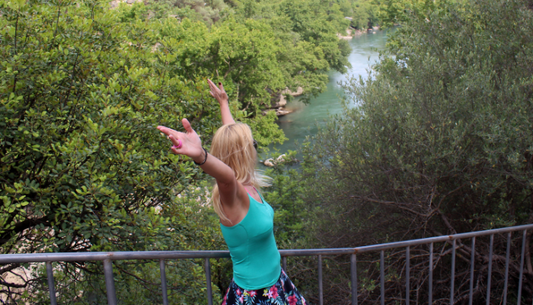 Solo traveler enjoying a scenic river view