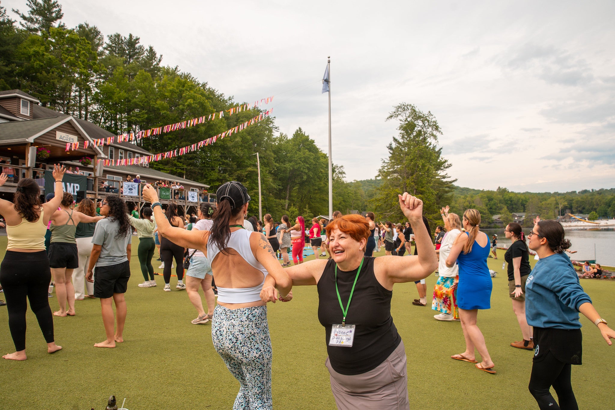 Women dancing outside at Camp Social